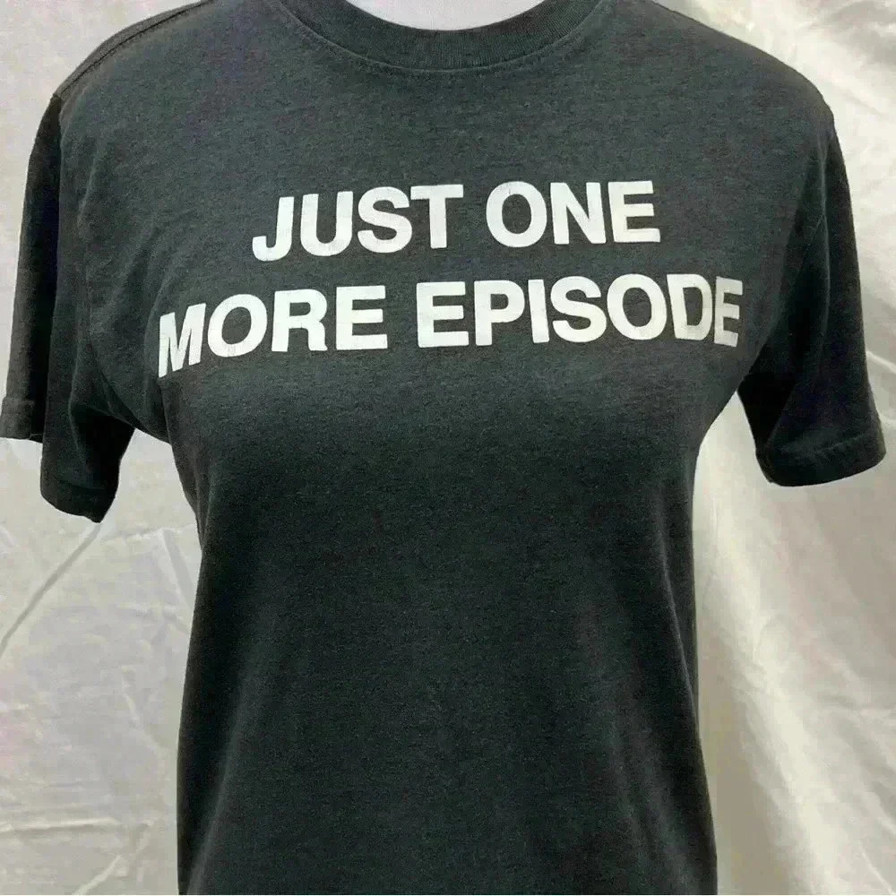 Dark grey graphic tee.